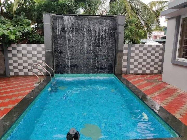 Pool with waterfall wall